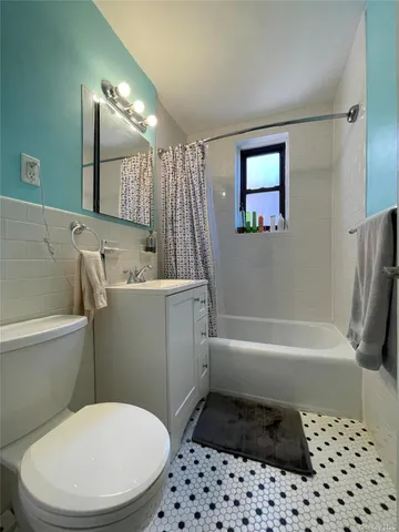 a bathroom with a toilet a sink and bathtub