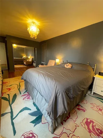 a bedroom with a bed and a walk in closet