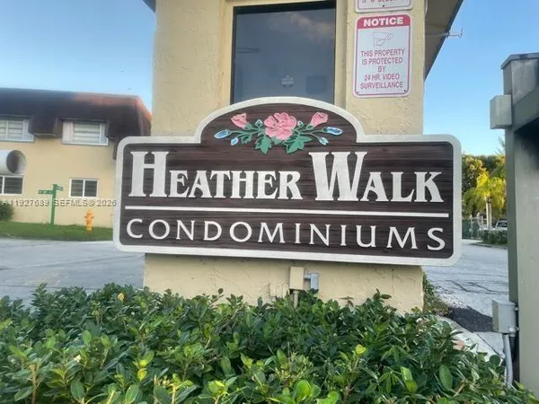 a sign broad in front of a building