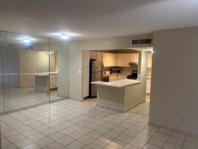 9002 Southwest 137th Street, Unit G27 Miami, FL 33176 - Photo 4 of 11 a room with a couch and chairs