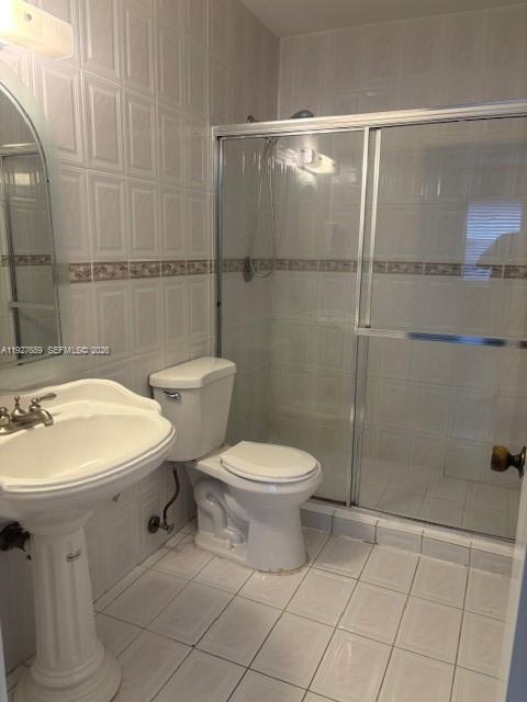 9002 Southwest 137th Street, Unit G27 Miami, FL 33176 - Photo 9 of 11 a bathroom with a sink toilet and shower