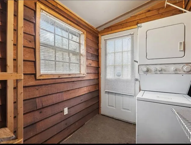 a bathroom with a bathtub and a window