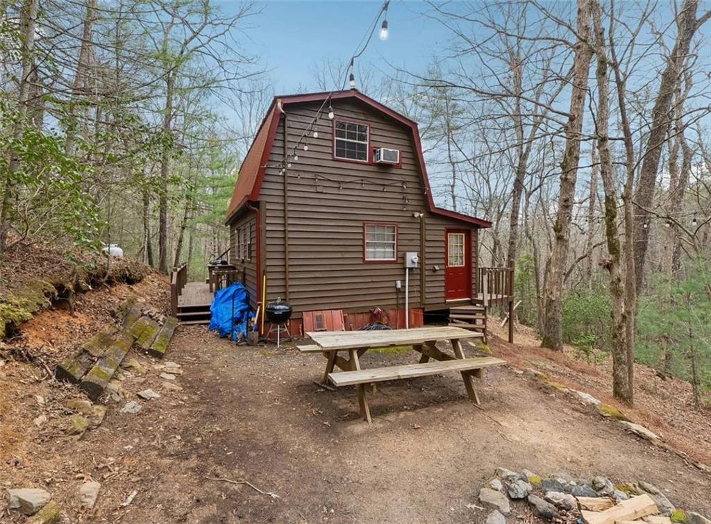 265 Wits End Way Cherry Log, GA 30522 - Photo 5 of 15 a blue bench sitting in front of a building