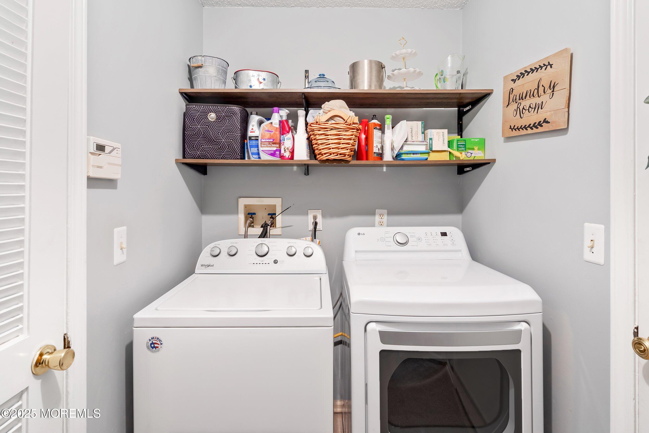 47 Crater Lake Road Howell, NJ 07731 - Photo 15 of 40 a utility room with dryer and washer