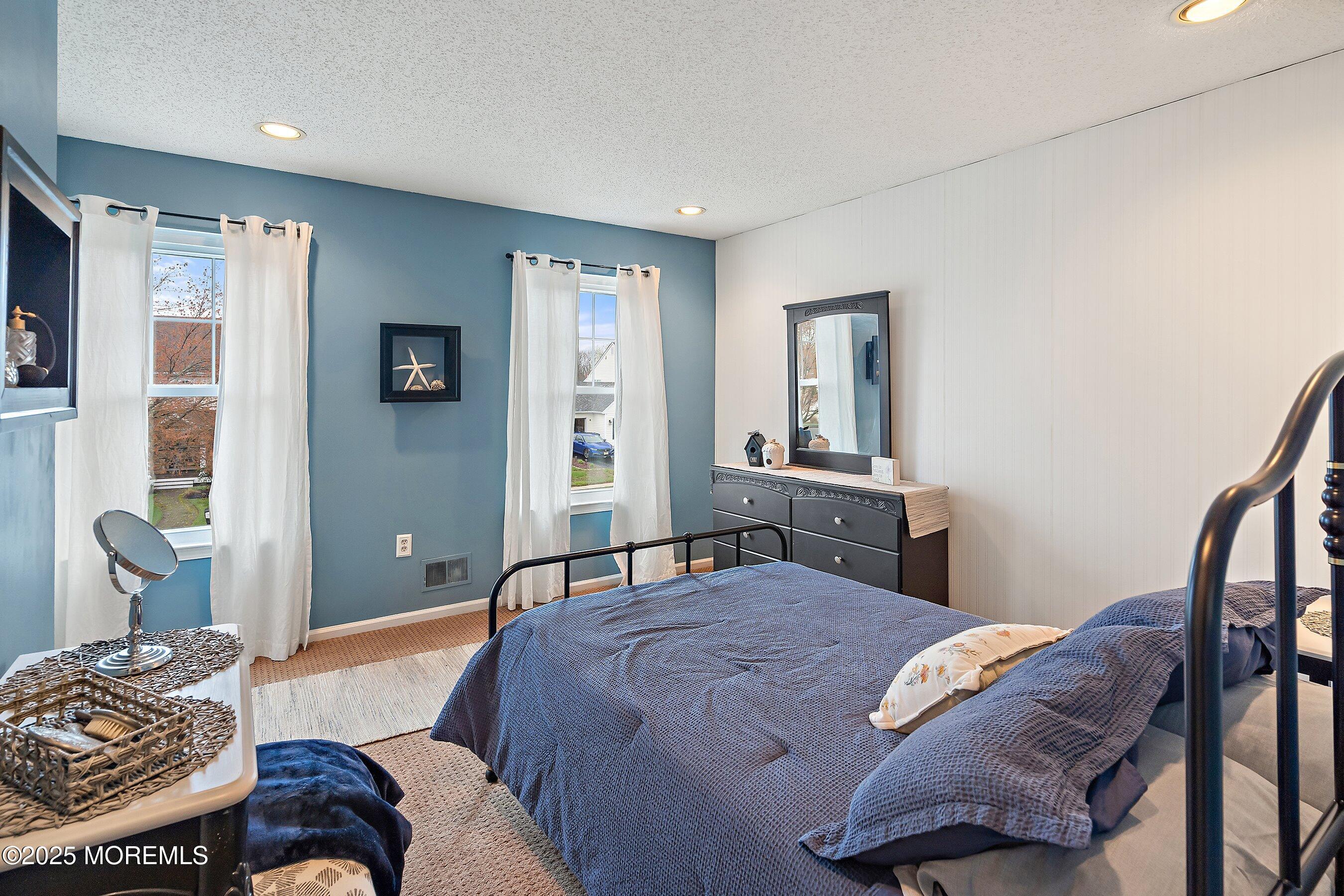 47 Crater Lake Road Howell, NJ 07731 - Photo 17 of 40 a bedroom with a bed and wooden floor