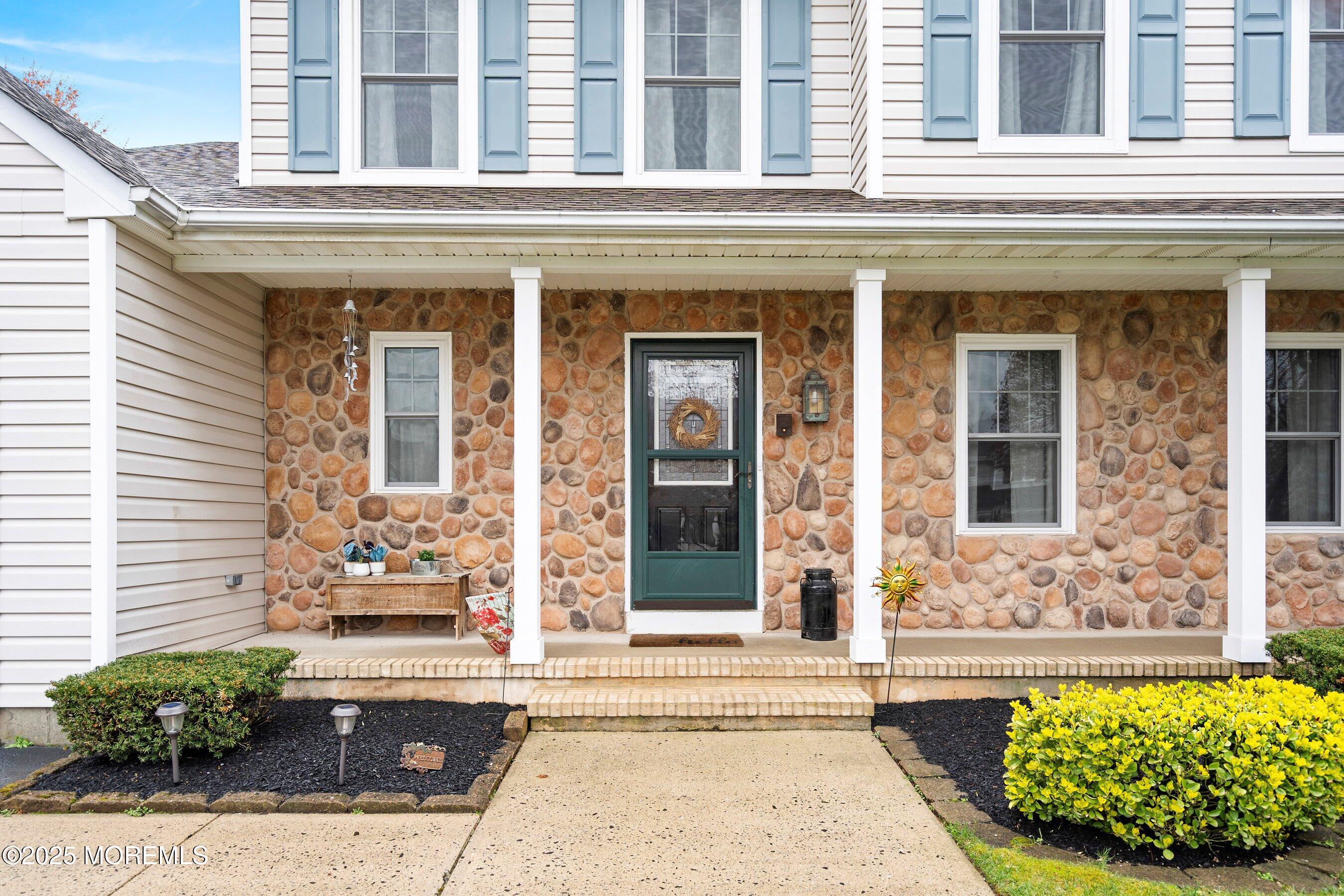47 Crater Lake Road Howell, NJ 07731 - Photo 2 of 40 front view of a brick house