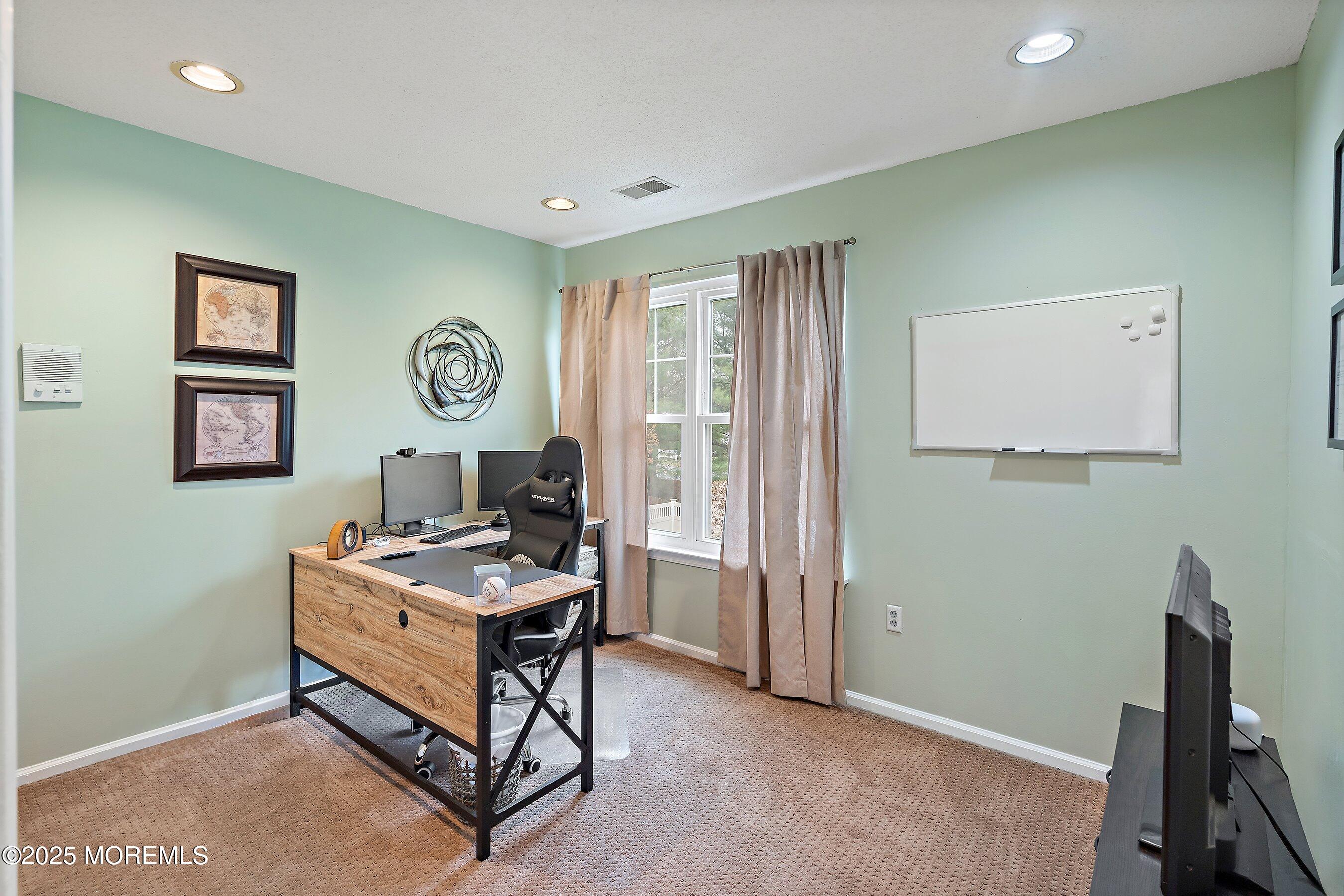47 Crater Lake Road Howell, NJ 07731 - Photo 21 of 40 a room with furniture a air conditioner and a window