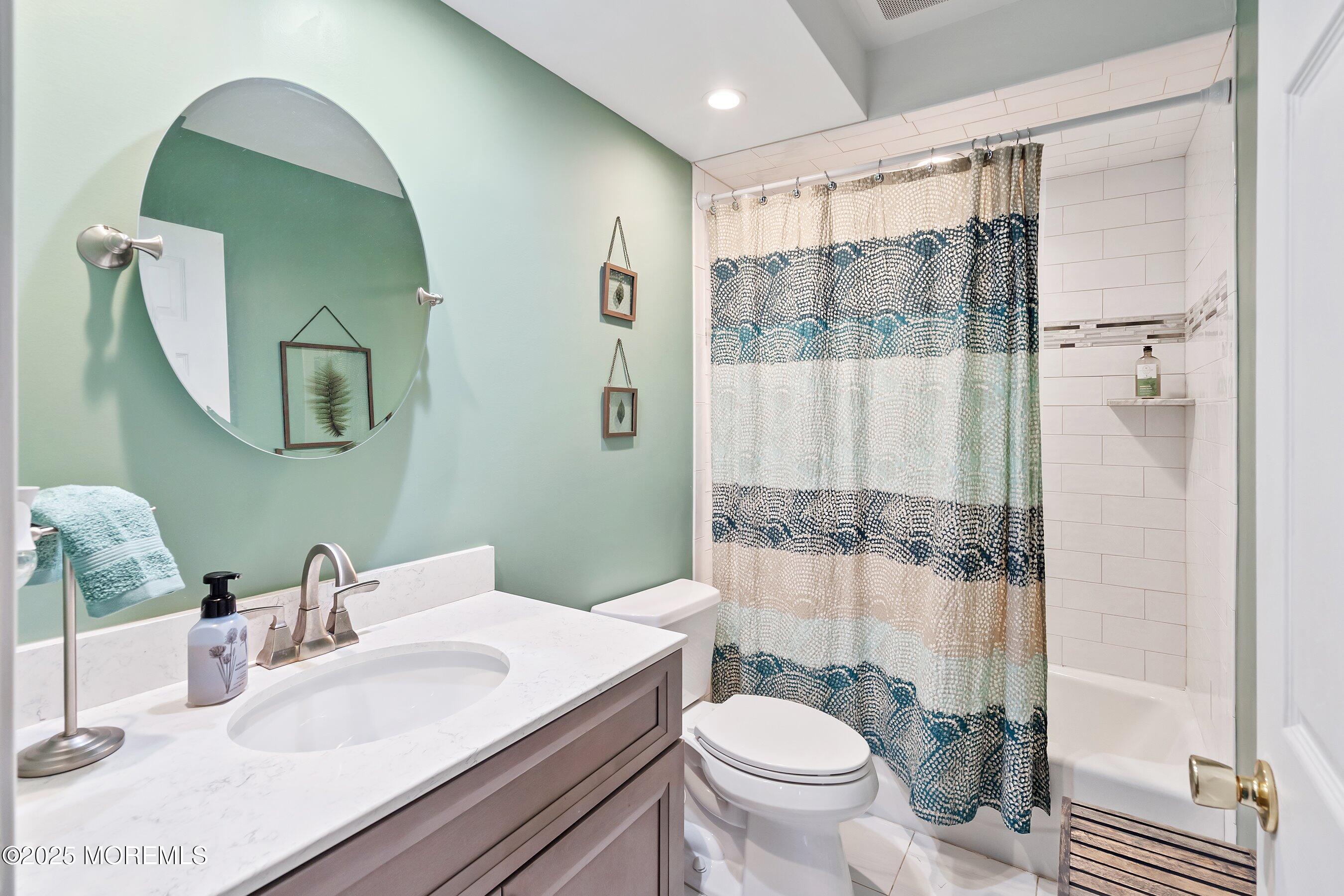 47 Crater Lake Road Howell, NJ 07731 - Photo 22 of 40 a bathroom with a sink toilet and shower