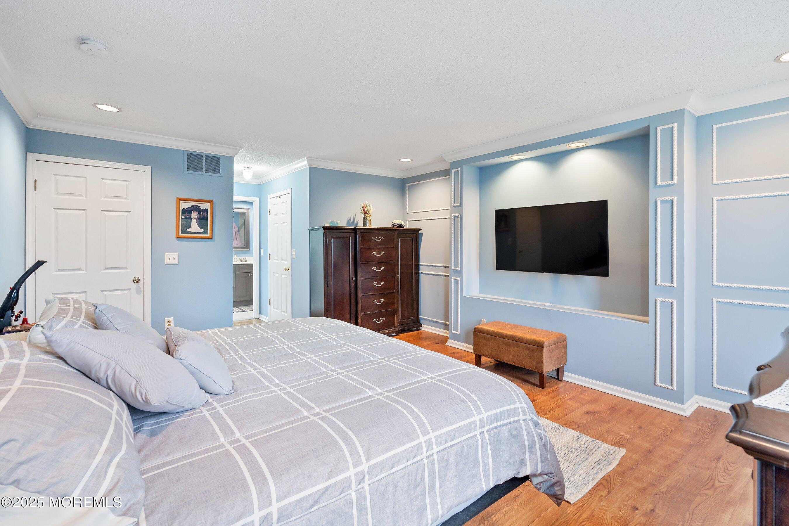 47 Crater Lake Road Howell, NJ 07731 - Photo 24 of 40 a bedroom with a bed and a flat screen tv