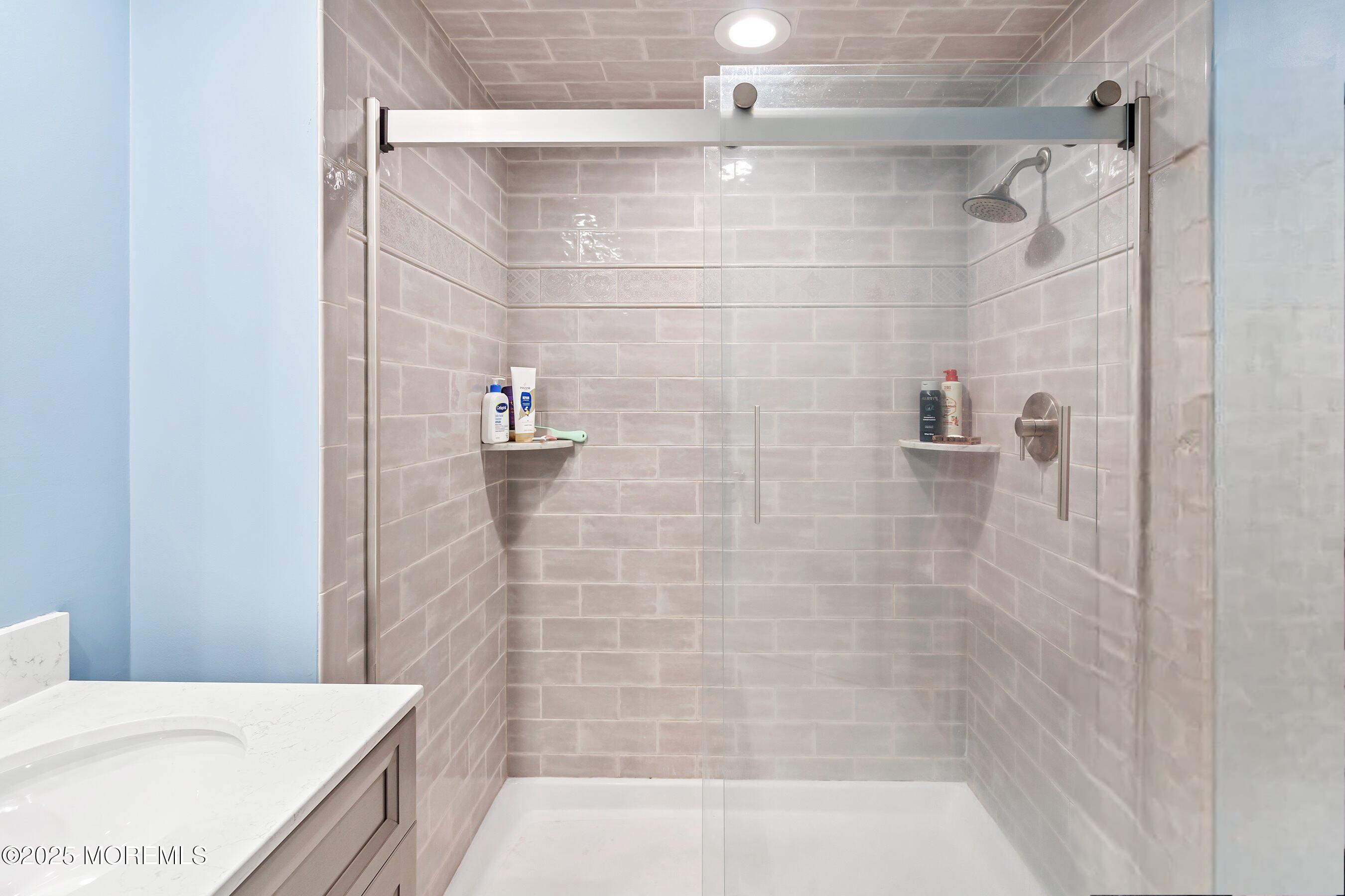 47 Crater Lake Road Howell, NJ 07731 - Photo 26 of 40 a bathroom with a bathtub and shower