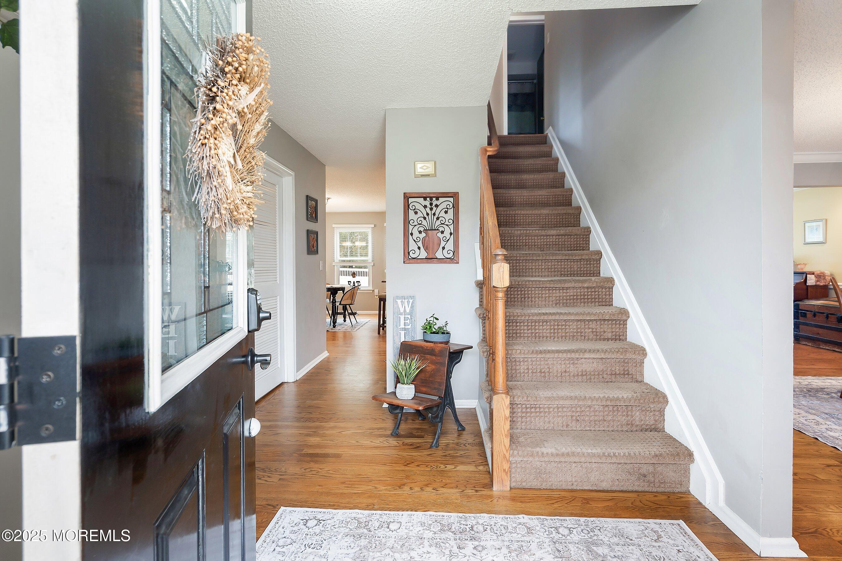47 Crater Lake Road Howell, NJ 07731 - Photo 3 of 40 a view of entryway and hall with wooden floor