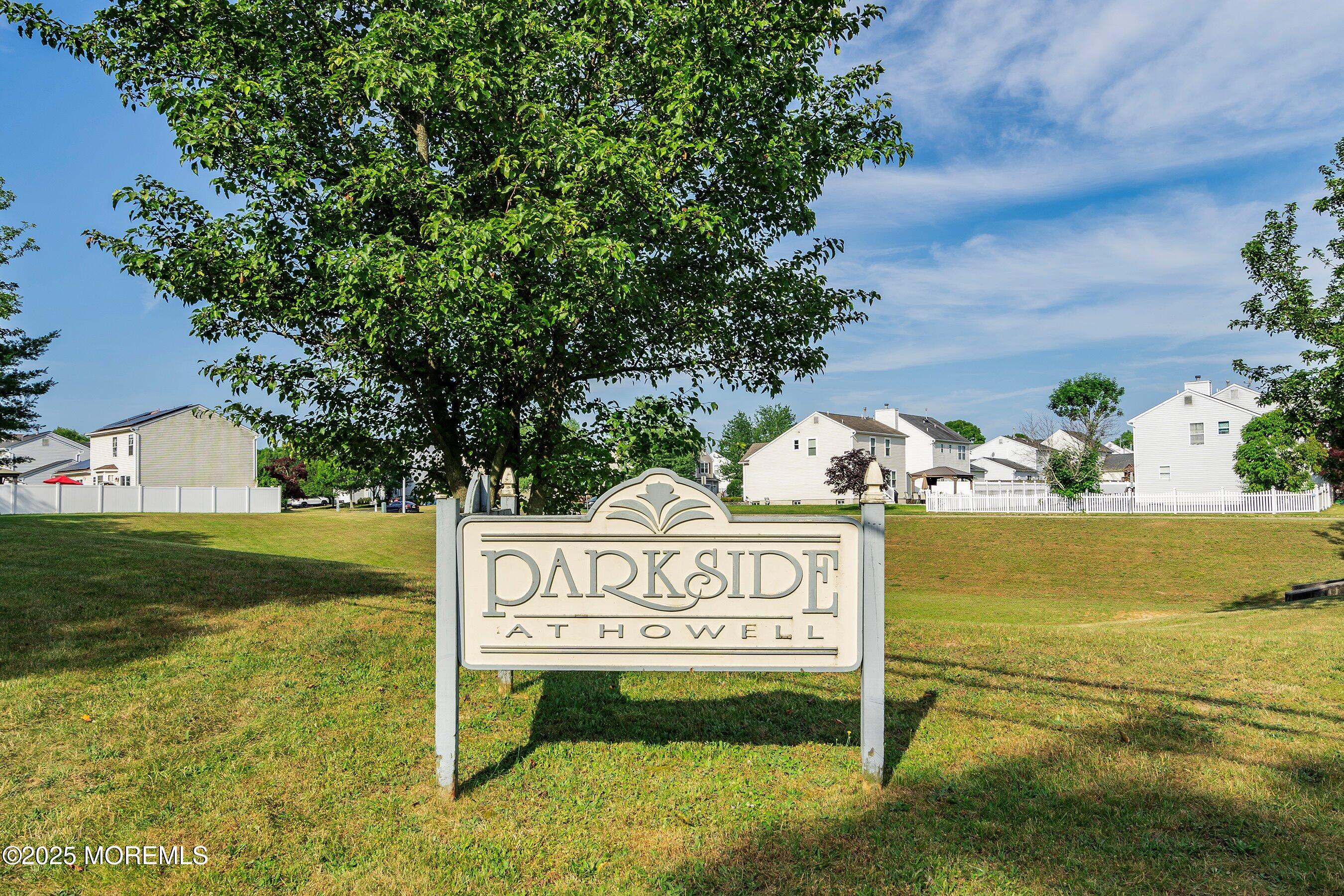 47 Crater Lake Road Howell, NJ 07731 - Photo 36 of 40 a sign that is on the side of the tree