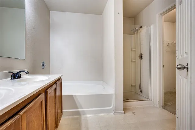 a bath room with a sink and a bath tub