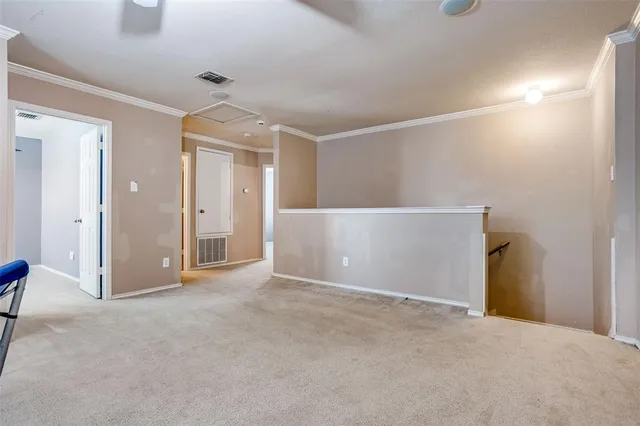 a view of an empty room with a bathroom