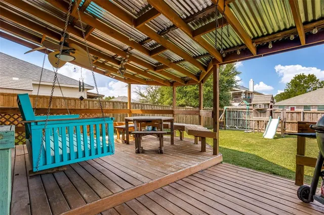 a view of a swimming pool with a patio