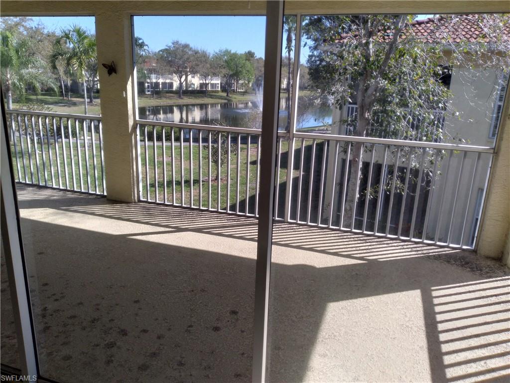 900 Diamond Circle, Unit 908 Naples, FL 34110 - Photo 11 of 22 a view of a balcony with wooden floor