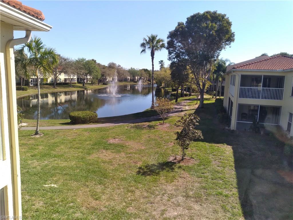 900 Diamond Circle, Unit 908 Naples, FL 34110 - Photo 15 of 22 a swimming pool with outdoor seating and yard
