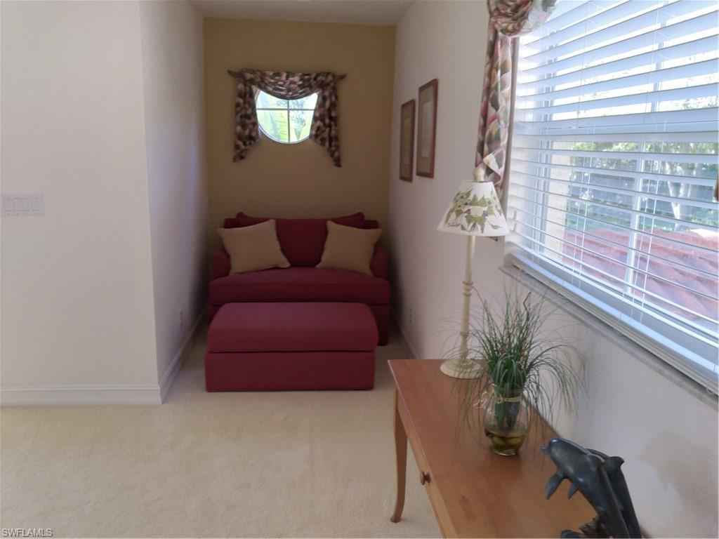 900 Diamond Circle, Unit 908 Naples, FL 34110 - Photo 18 of 22 a potted plant sitting on a dresser next to a window