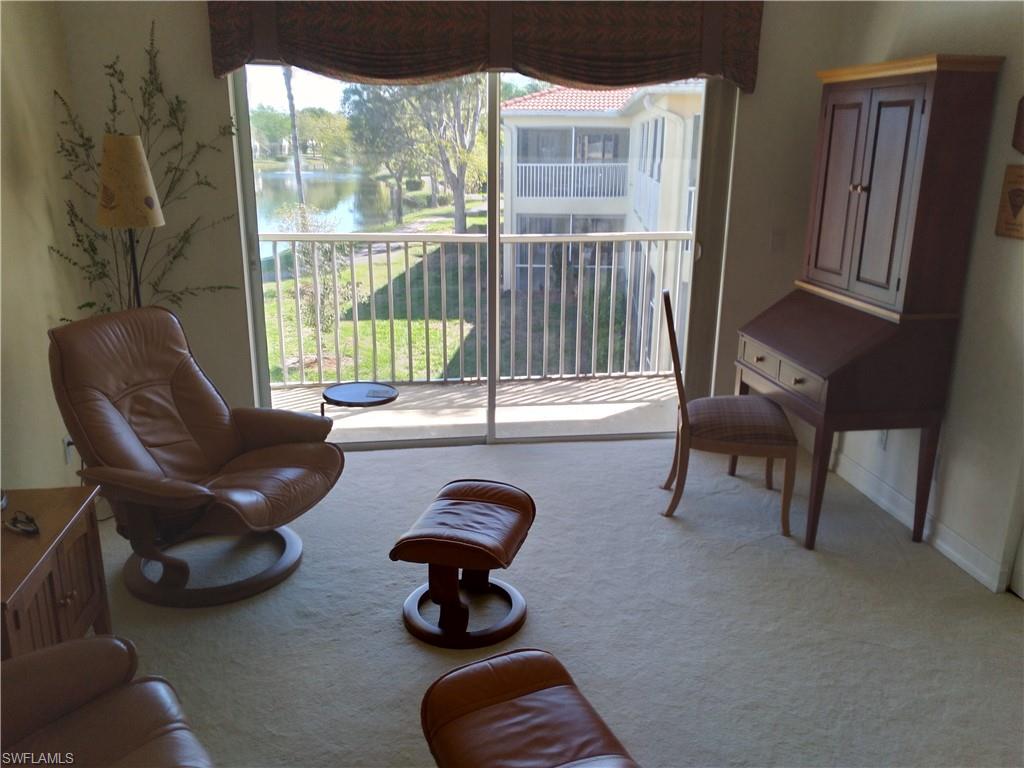 900 Diamond Circle, Unit 908 Naples, FL 34110 - Photo 2 of 22 a view of living room with furniture and windows