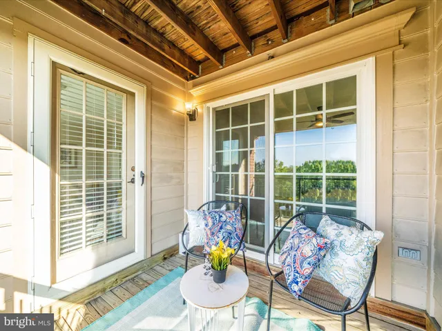 a view of a living room and balcony
