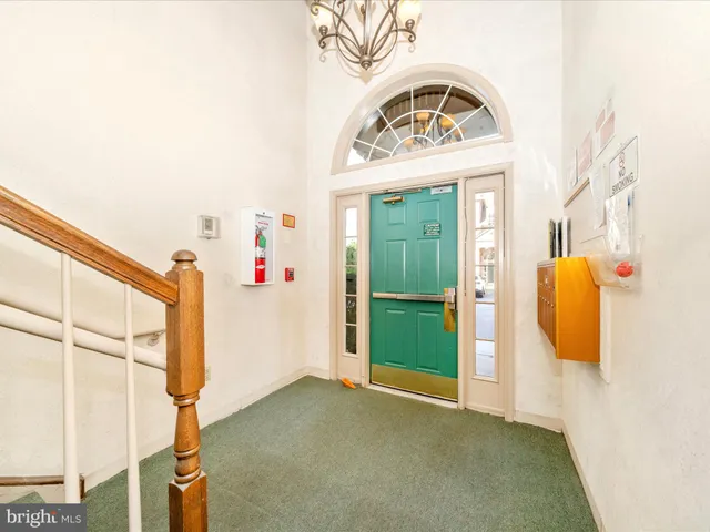 a view of brick house with potted plants