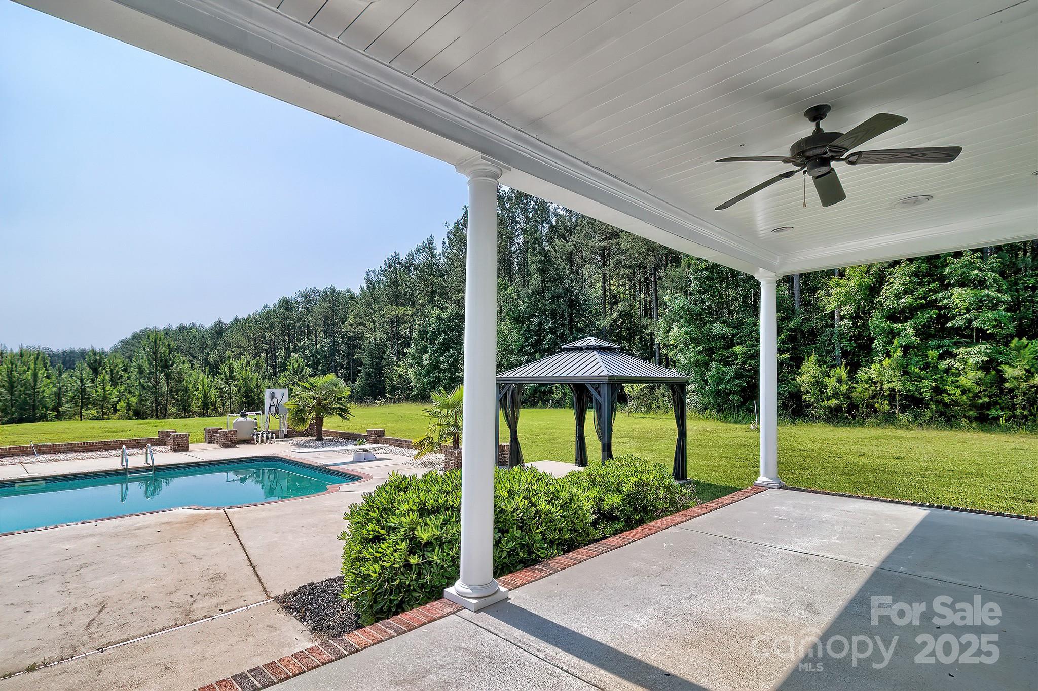 6268 Hope Road Winnsboro, SC 29180 - Photo 11 of 48 a view of a swimming pool with a yard