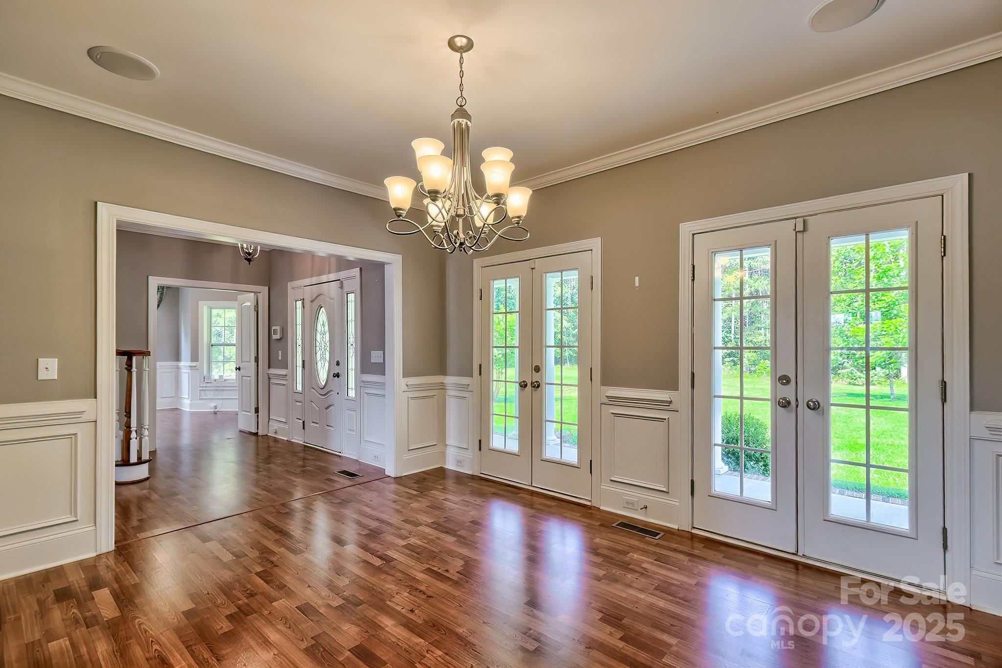 6268 Hope Road Winnsboro, SC 29180 - Photo 13 of 48 a view of a big room with wooden floor and windows