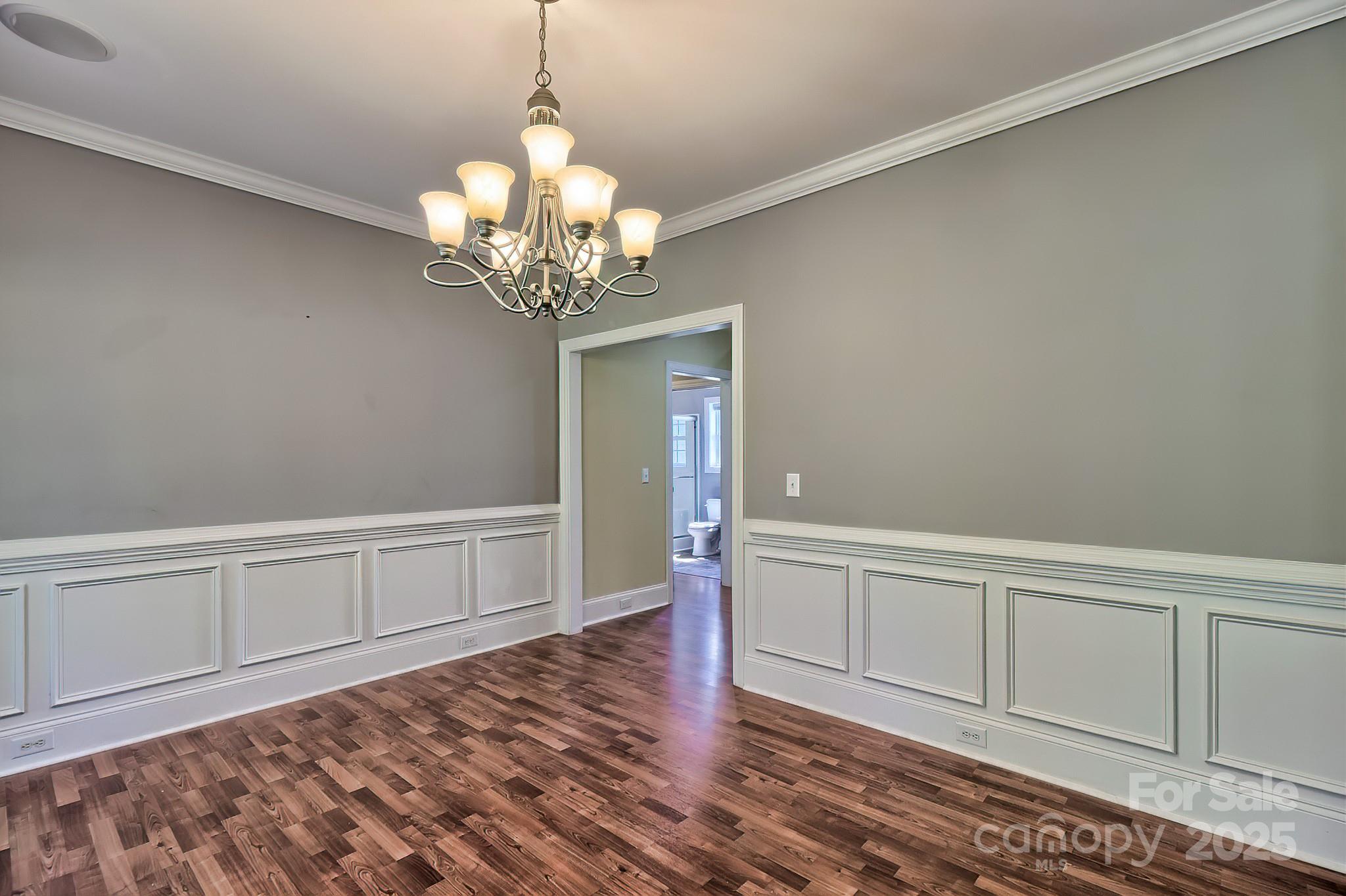 6268 Hope Road Winnsboro, SC 29180 - Photo 14 of 48 a view of an empty room with wooden floor