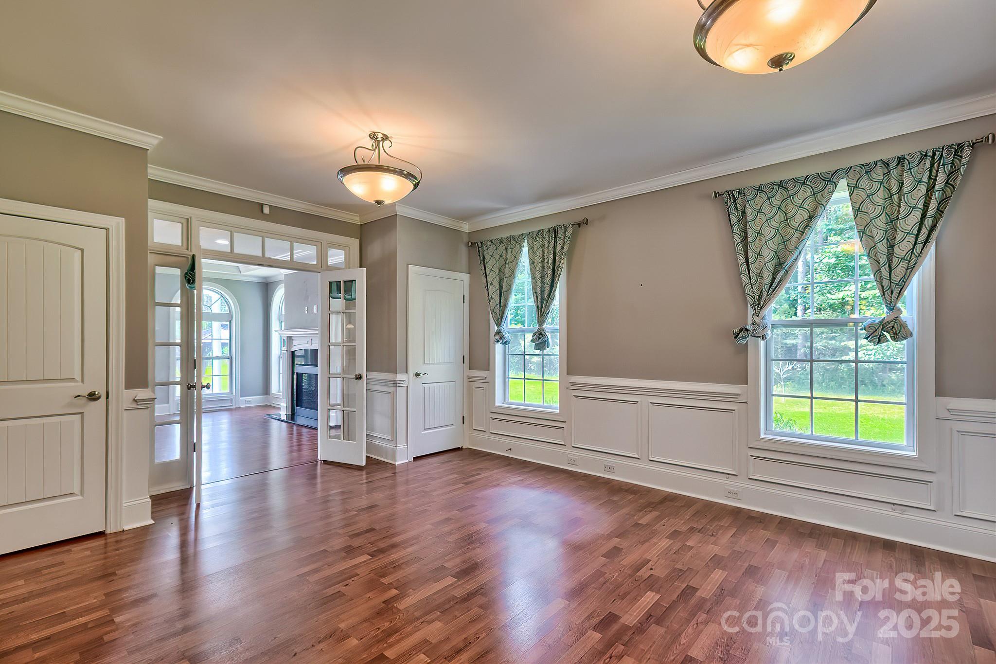 6268 Hope Road Winnsboro, SC 29180 - Photo 15 of 48 an empty room with wooden floor fan and windows