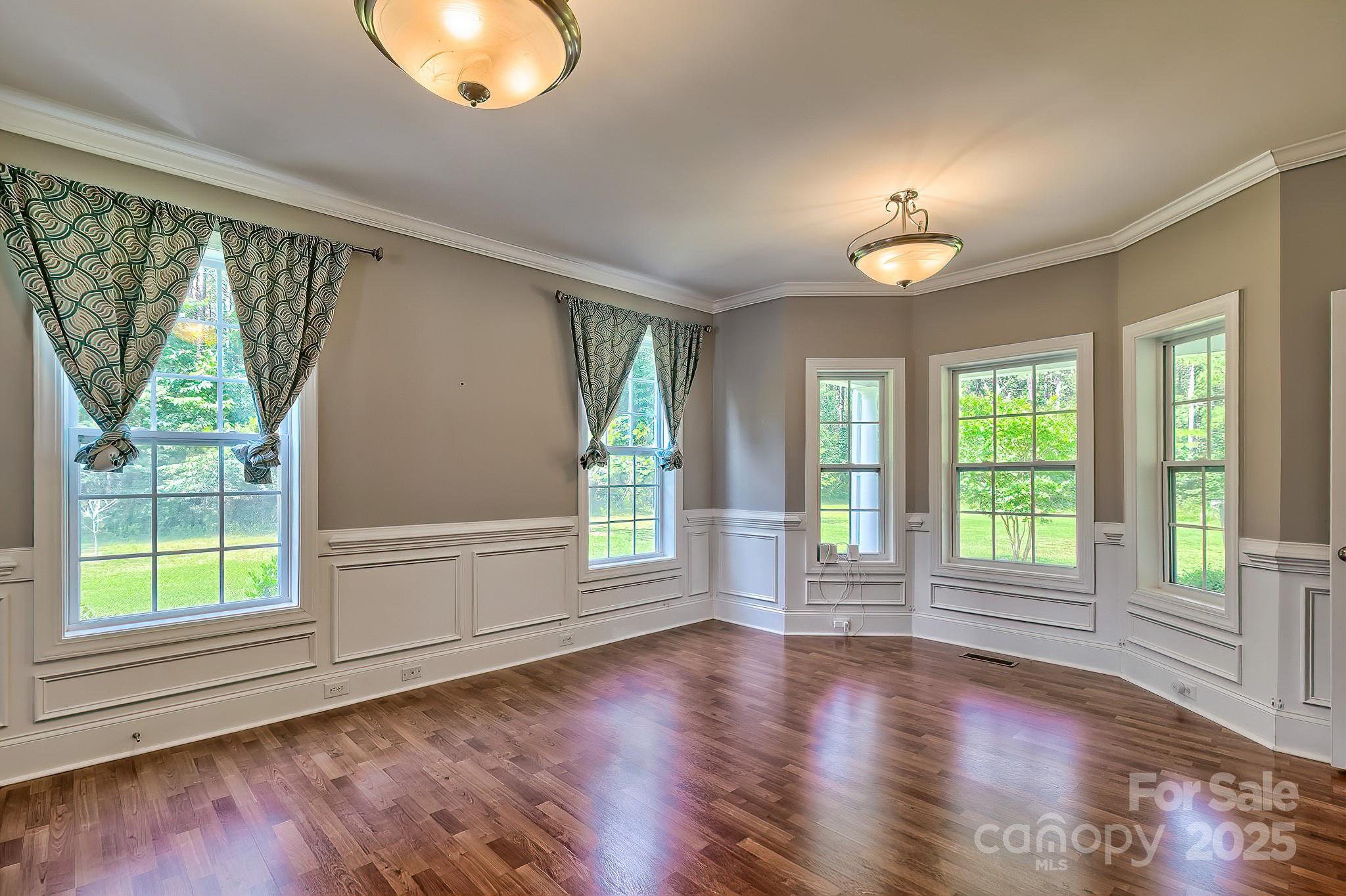 6268 Hope Road Winnsboro, SC 29180 - Photo 16 of 48 a view of an empty room with wooden floor and a window