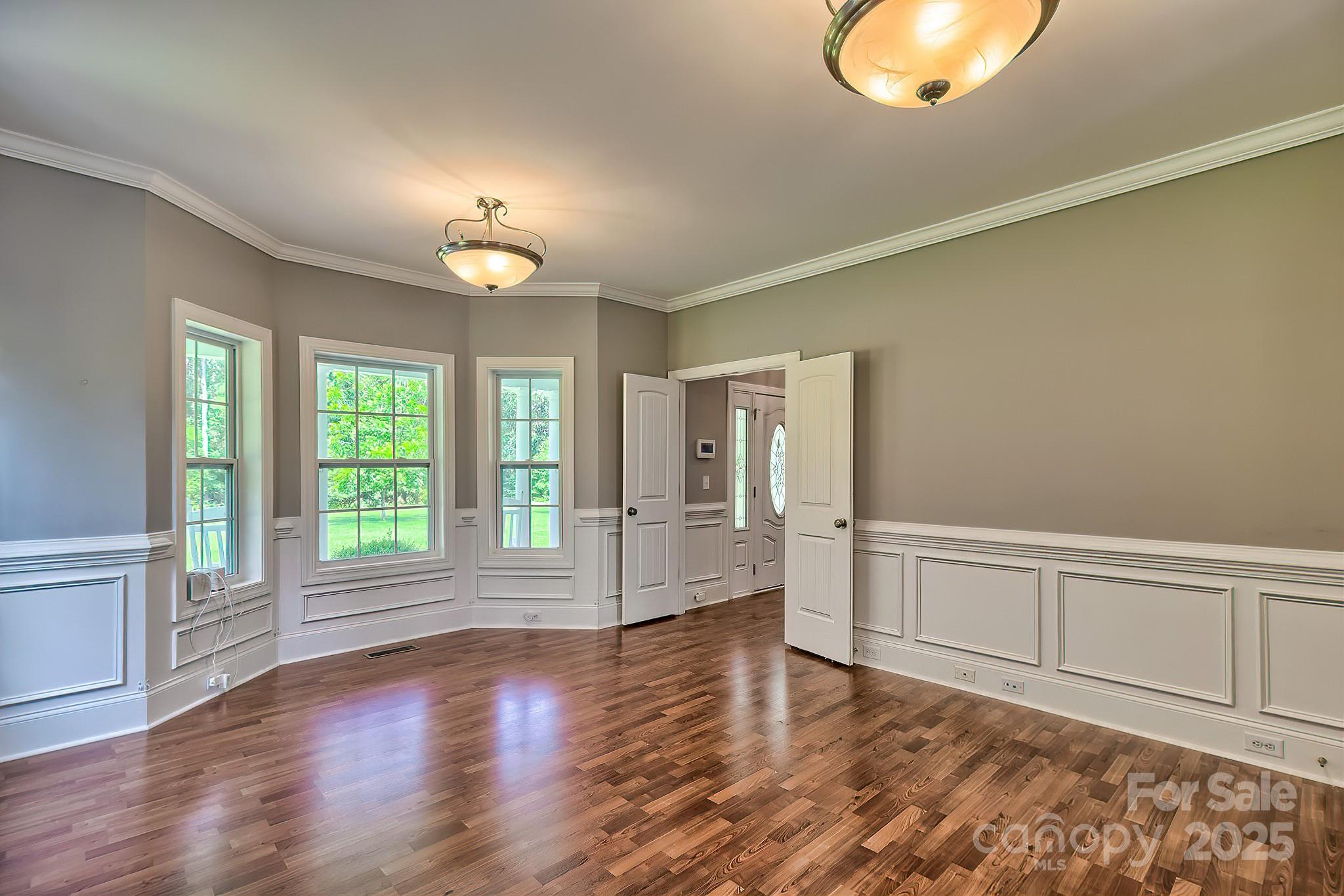 6268 Hope Road Winnsboro, SC 29180 - Photo 17 of 48 an empty room with wooden floor and windows