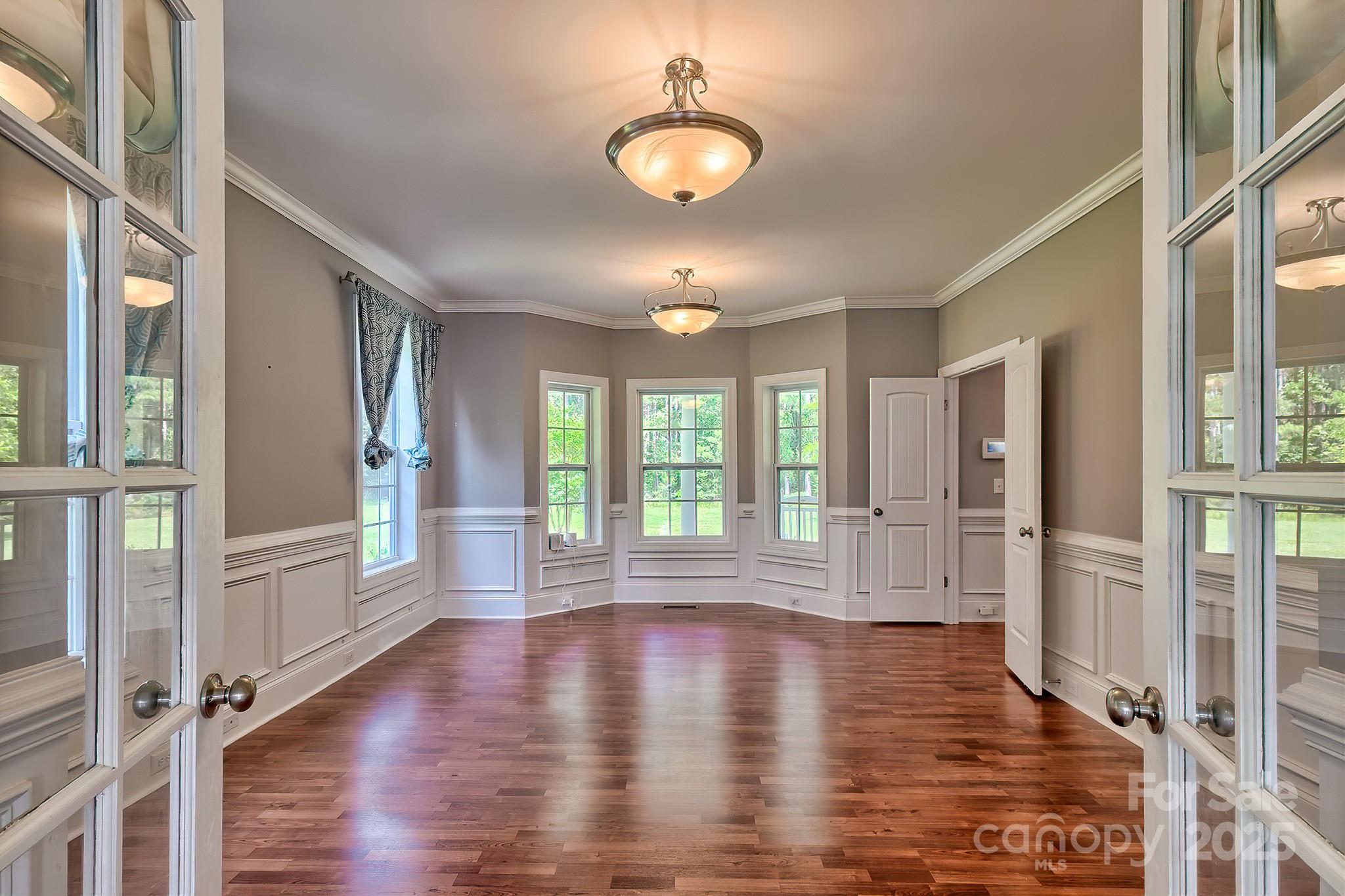 6268 Hope Road Winnsboro, SC 29180 - Photo 18 of 48 a view of empty room with wooden floor and fan