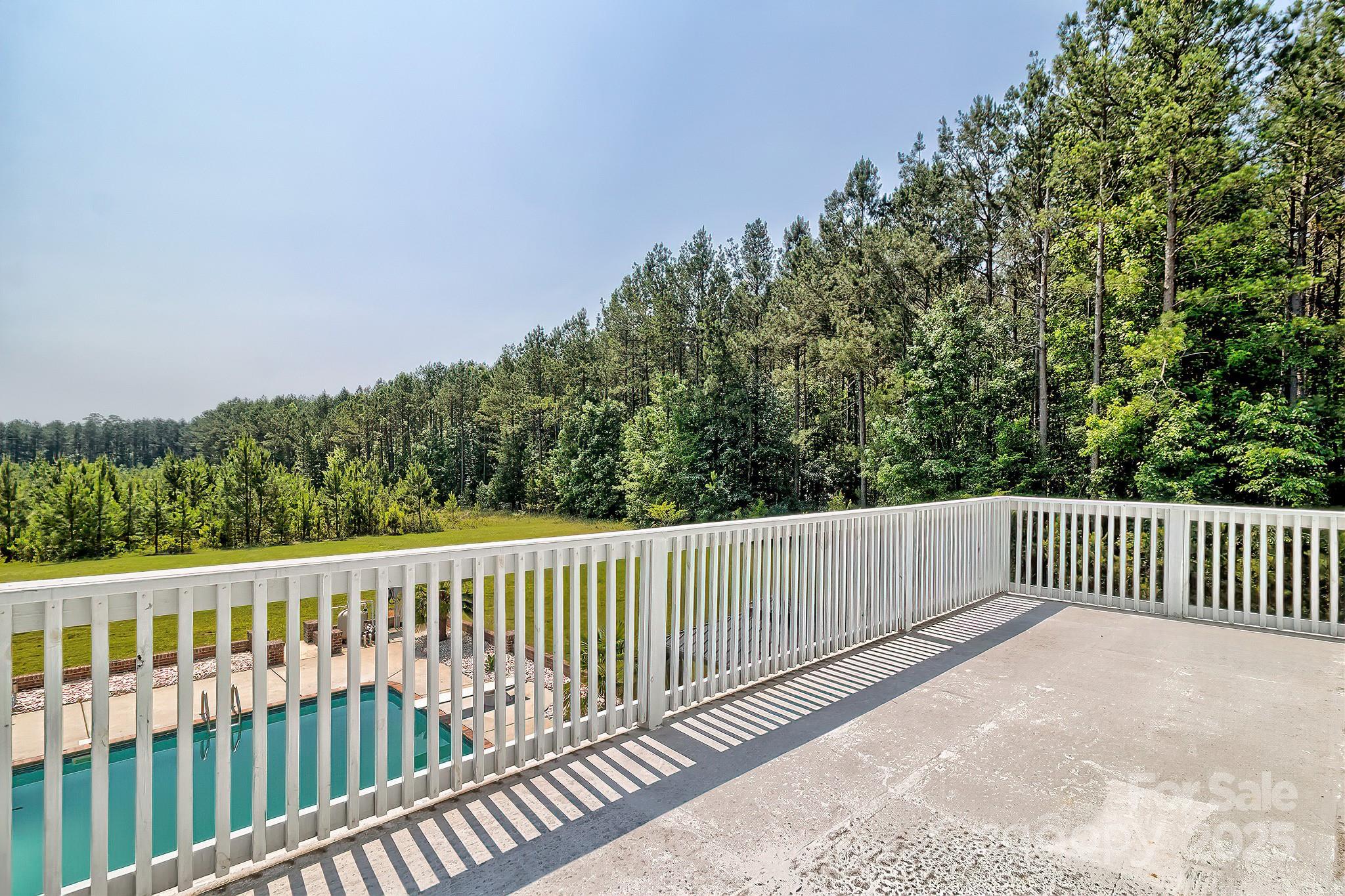 6268 Hope Road Winnsboro, SC 29180 - Photo 40 of 48 a balcony with wooden floor and fence