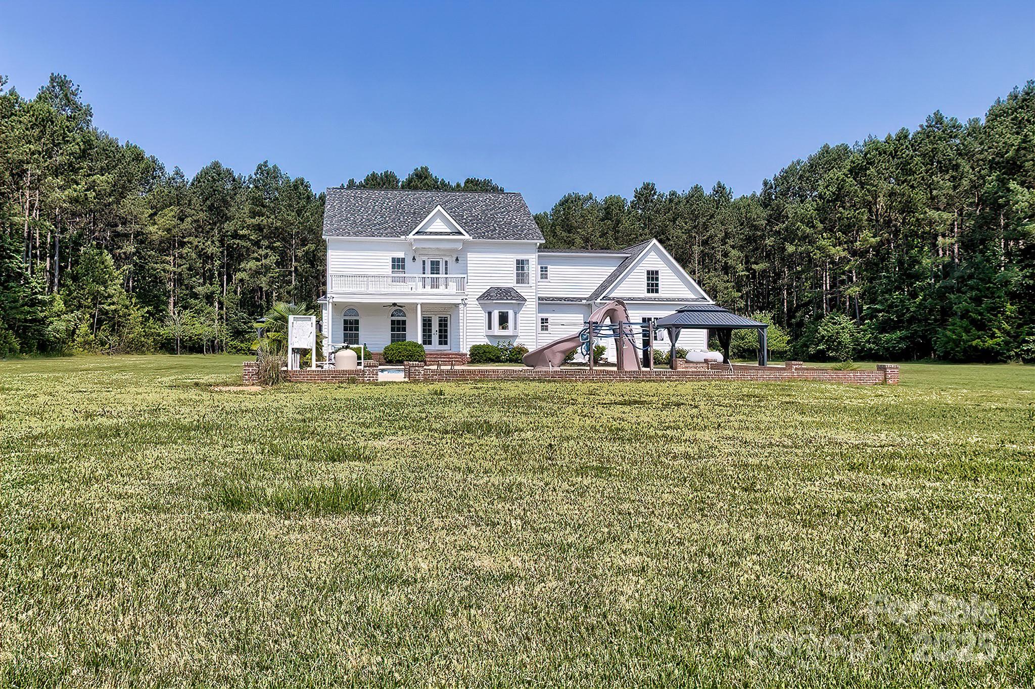 6268 Hope Road Winnsboro, SC 29180 - Photo 4 of 48 a front view of a house with a yard