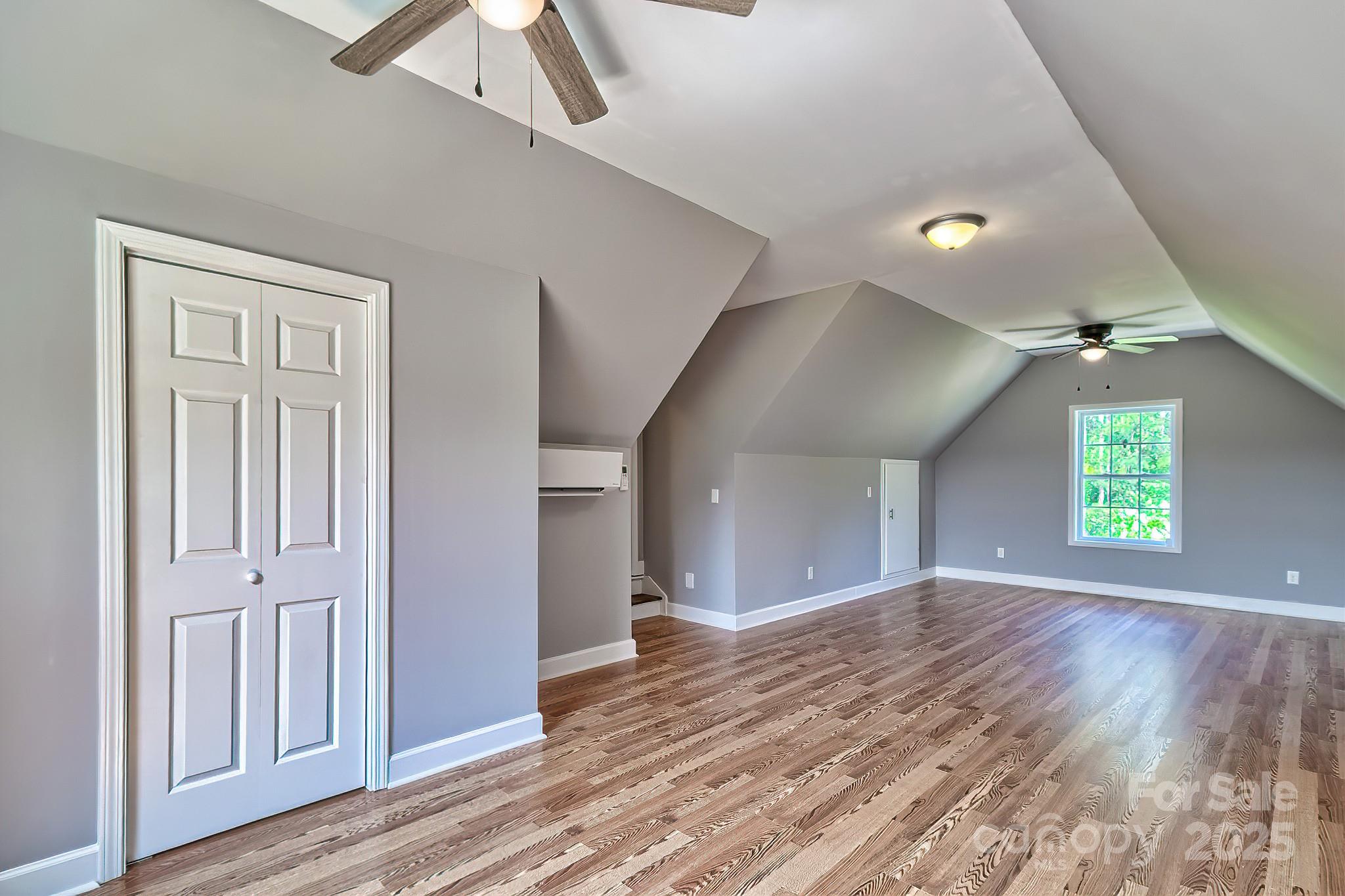 6268 Hope Road Winnsboro, SC 29180 - Photo 45 of 48 wooden floor in an empty room with a window