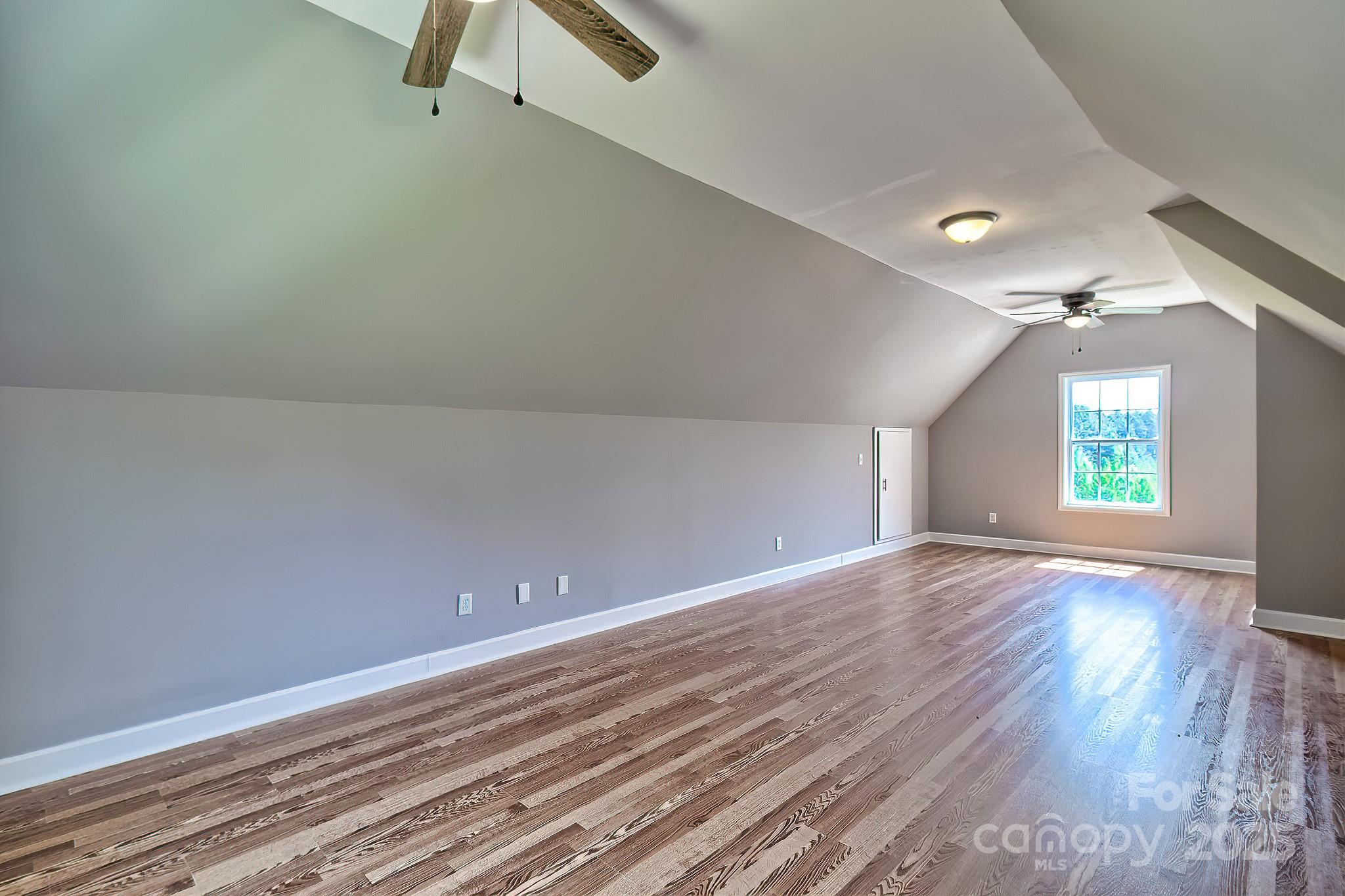 6268 Hope Road Winnsboro, SC 29180 - Photo 46 of 48 wooden floor in an empty room with a window