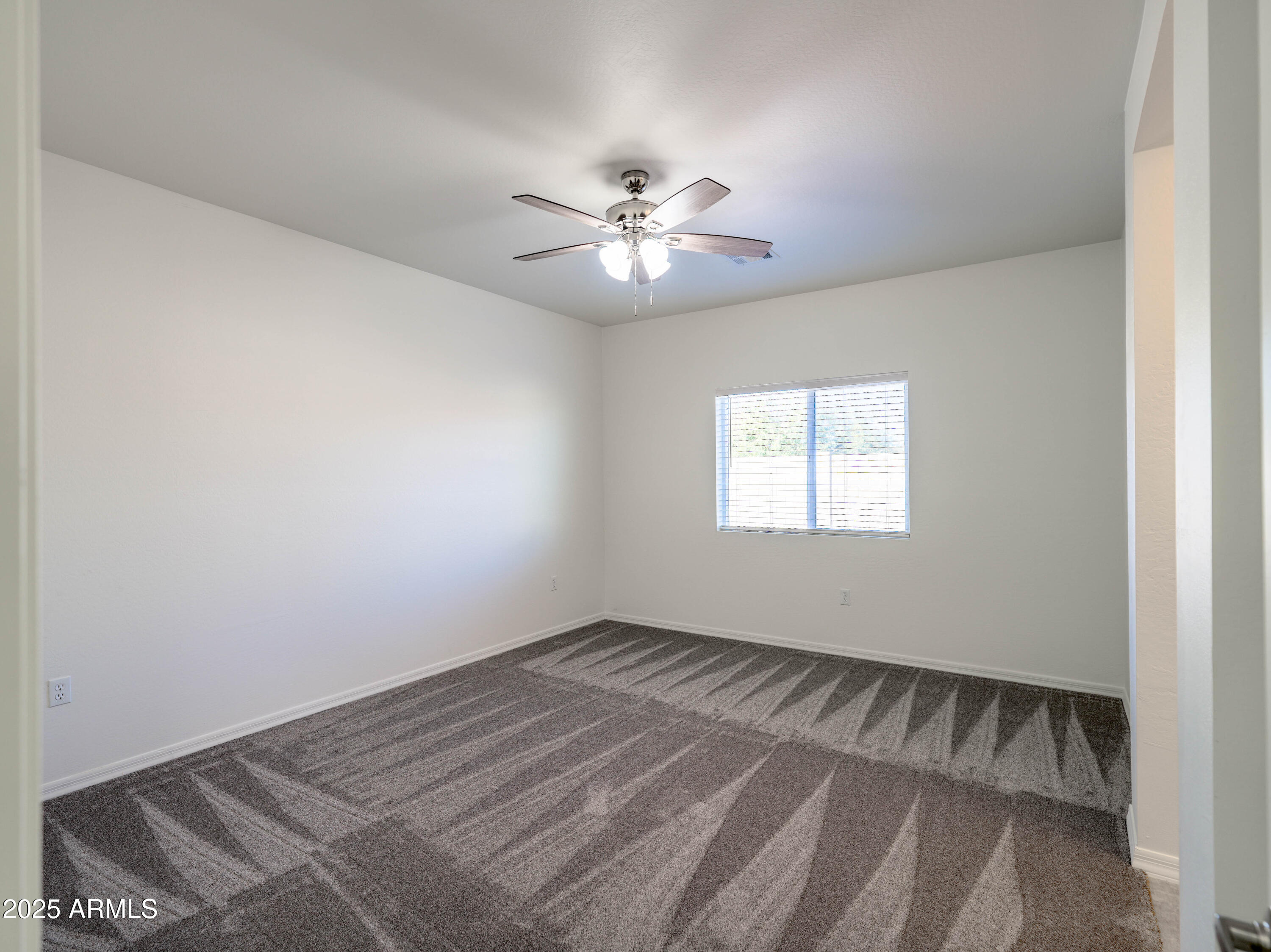 14534 South Diablo Road Arizona City, AZ 85123 - Photo 12 of 36 a view of an empty room with a window