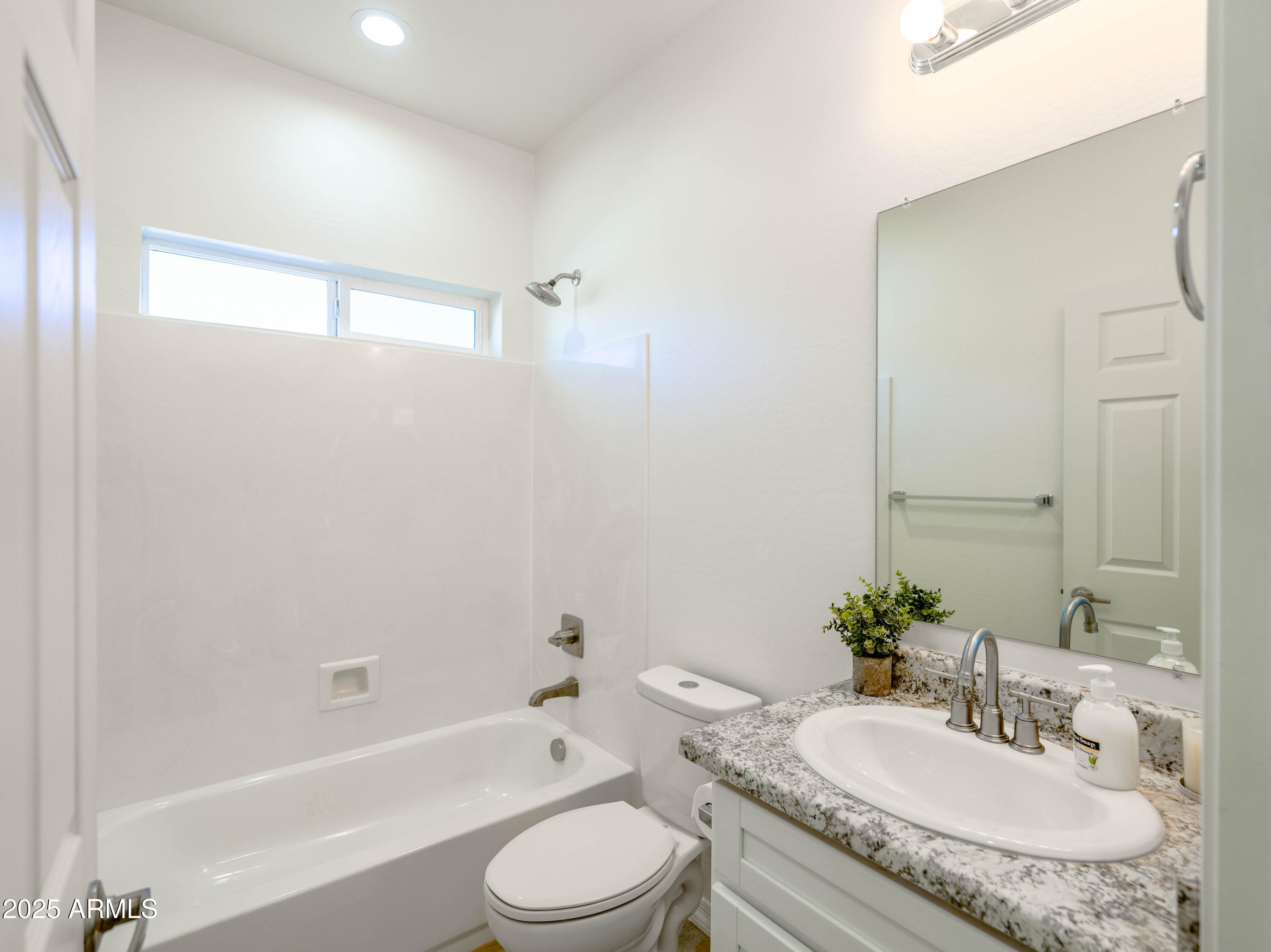 14534 South Diablo Road Arizona City, AZ 85123 - Photo 18 of 36 a bathroom with a granite countertop sink a toilet and shower