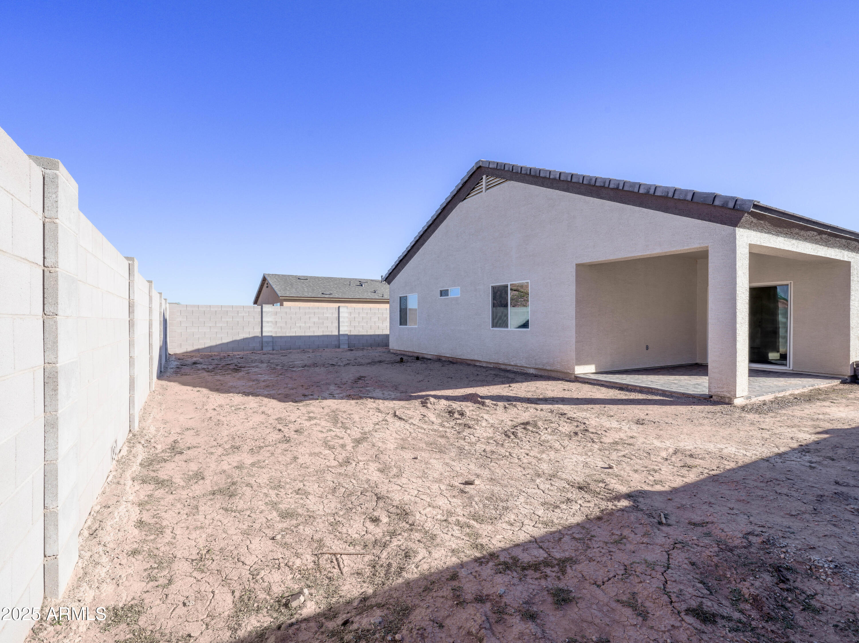 14534 South Diablo Road Arizona City, AZ 85123 - Photo 26 of 36 a view of a grey house with a yard