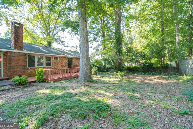 a view of backyard with green space
