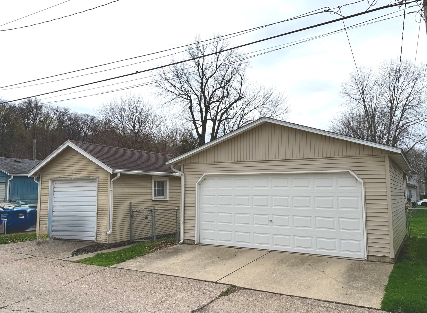 422 45th Street Moline, IL 61265 - Photo 19 of 22 a small white house with a white roof and table and chairs next to window