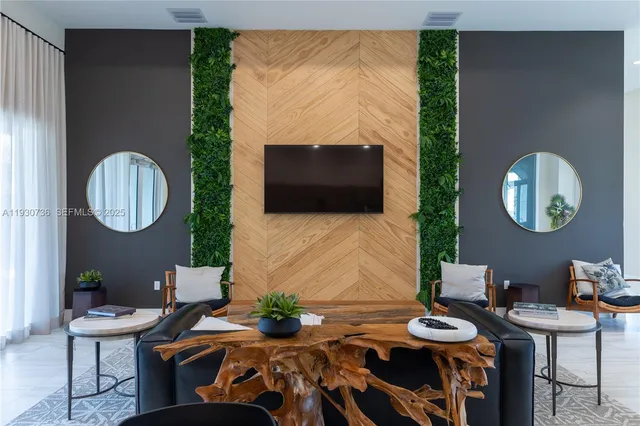 a living room with furniture a rug and a window
