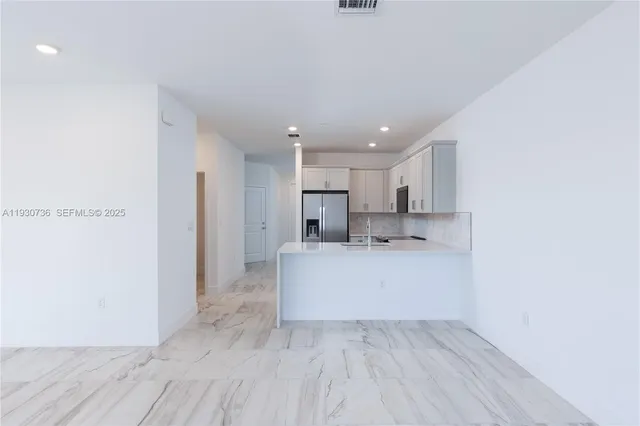 a view of kitchen with wooden floor