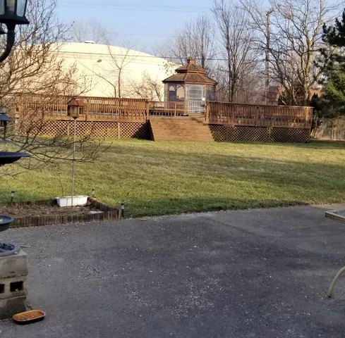 a view of yard with swimming pool