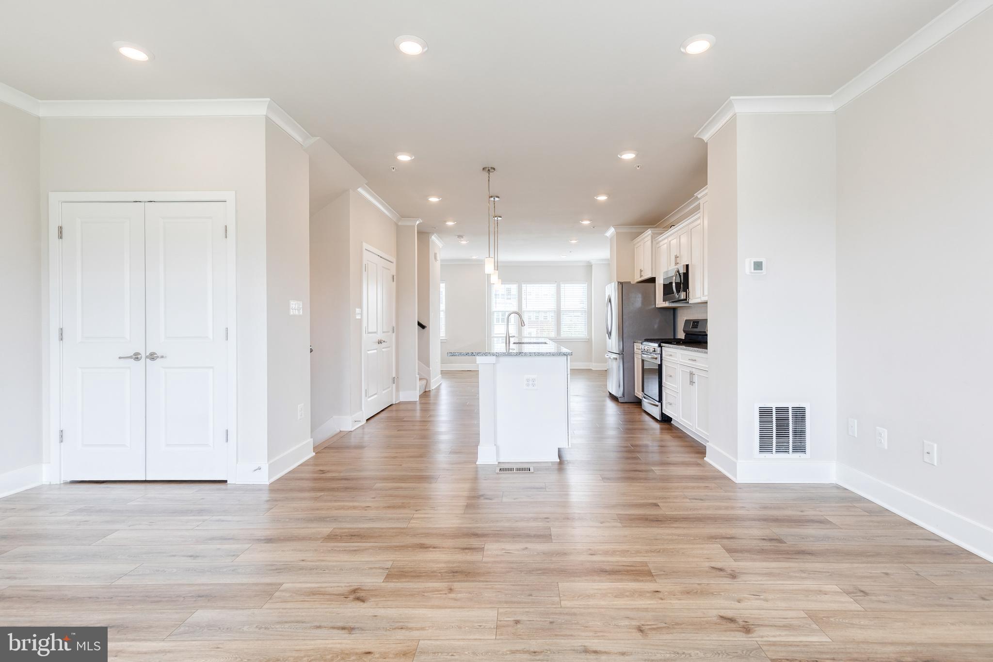 2008 Ivory Brook Road Baltimore, MD 21244 - Photo 11 of 35 a view of kitchen with refrigerator and wooden floor