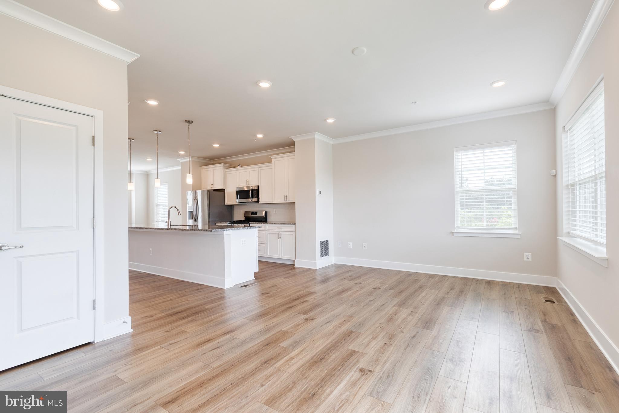 2008 Ivory Brook Road Baltimore, MD 21244 - Photo 12 of 35 a view of kitchen with kitchen island wooden floors and center island