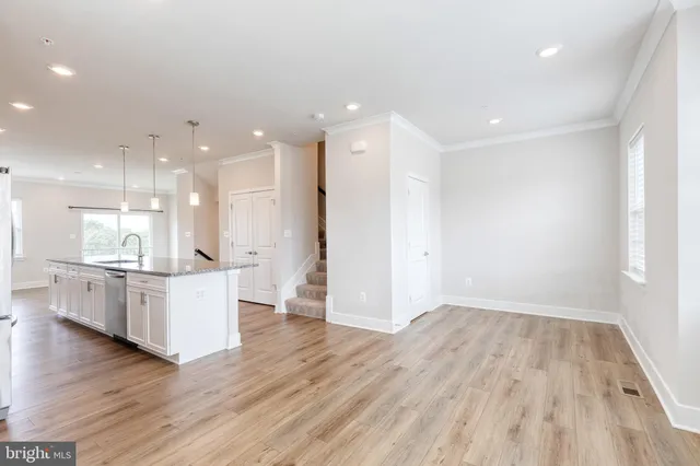 a large kitchen with a large counter top appliances and cabinets