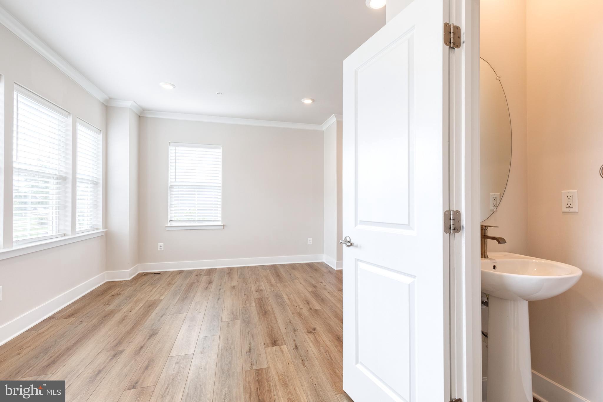 2008 Ivory Brook Road Baltimore, MD 21244 - Photo 22 of 35 a bathroom with a sink and a toilet