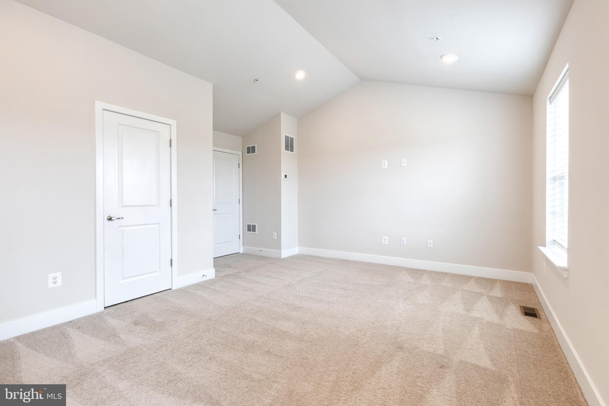 2008 Ivory Brook Road Baltimore, MD 21244 - Photo 29 of 35 an empty room with a natural light