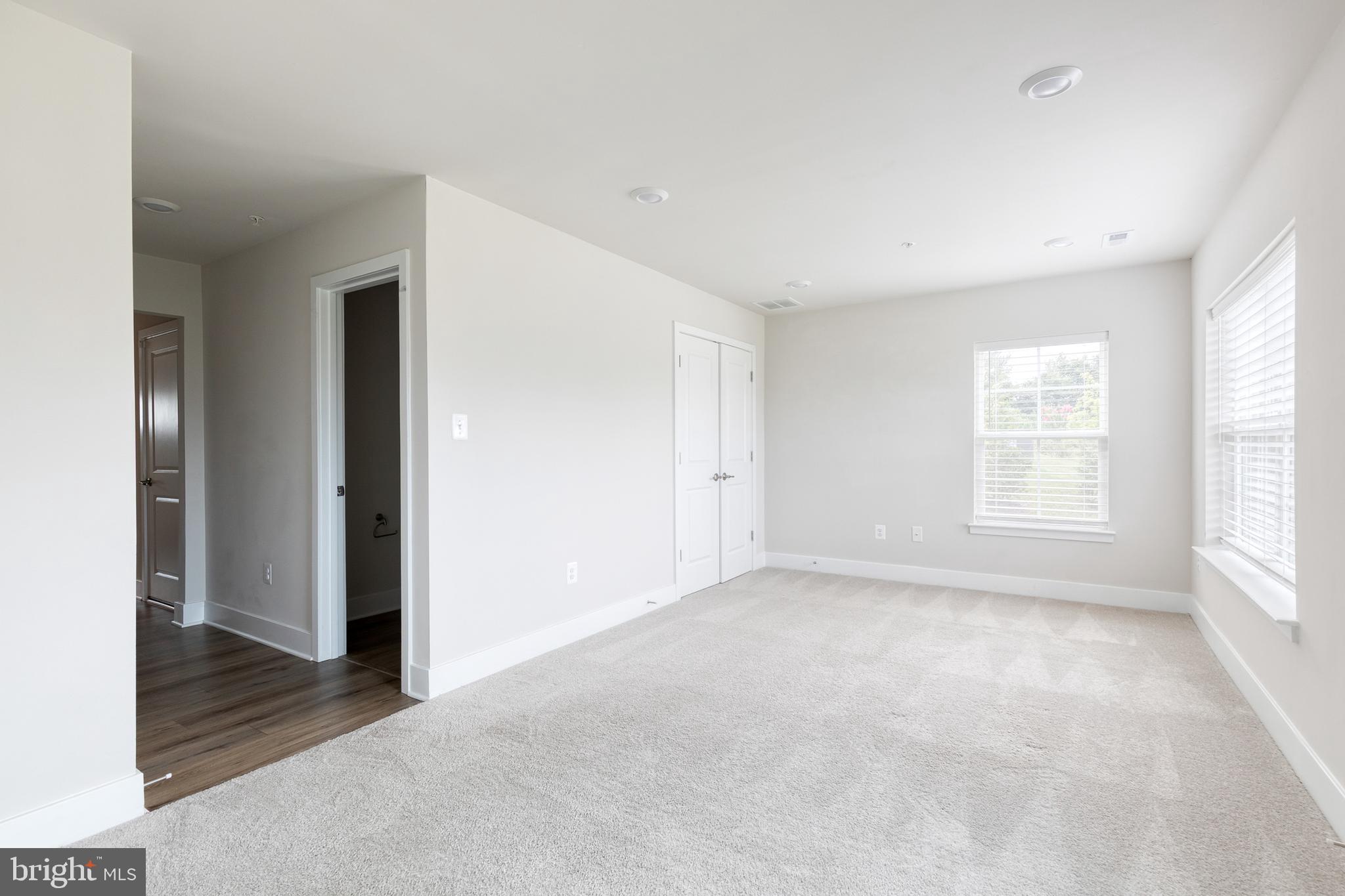 2008 Ivory Brook Road Baltimore, MD 21244 - Photo 5 of 35 a view of an empty room with a window